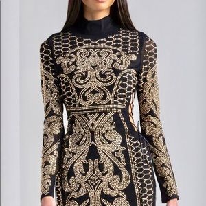 black evening dress with a touch of gold